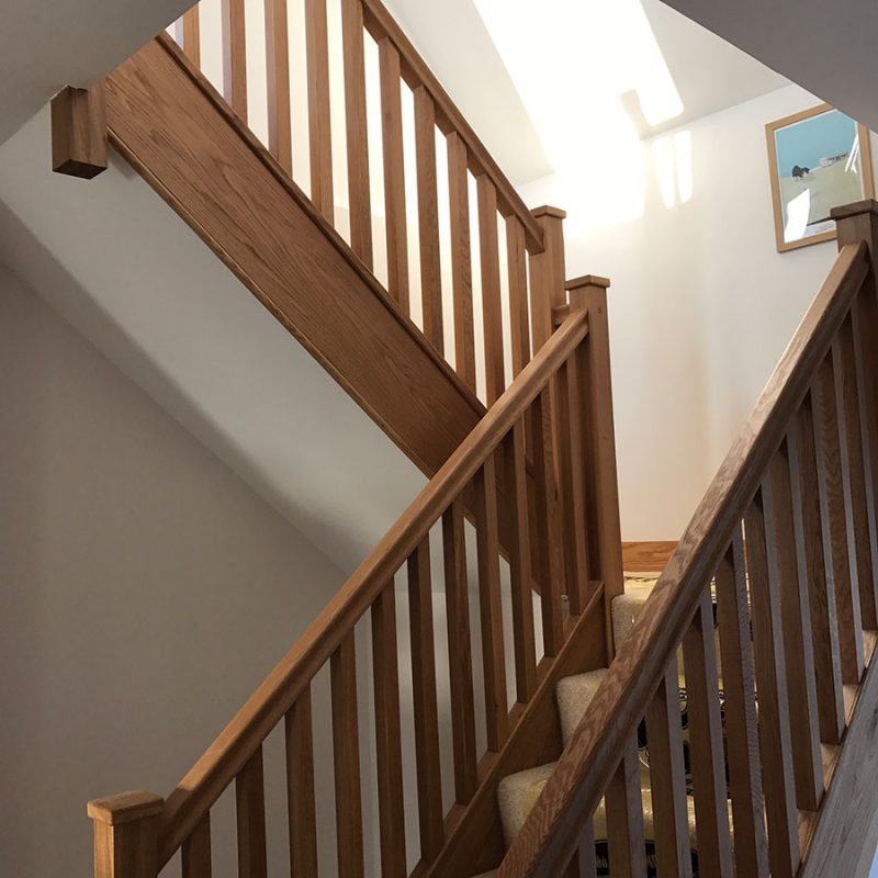 A half-turn staircase leading up into a loft conversion.