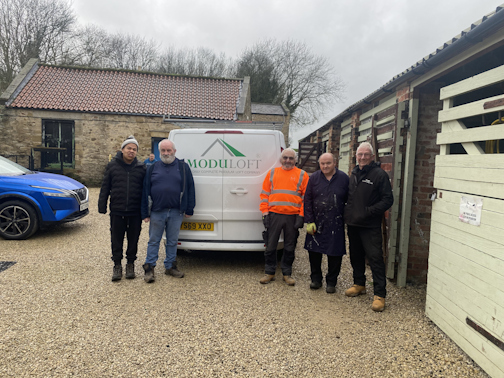 Moduloft and Ripon Walled Garden staff stand next to a Moduloft van.