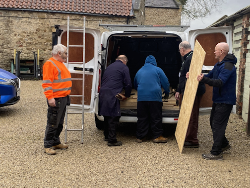 Moduloft and Ripon Walled Garden staff retrieve donated wood from a Moduloft van.