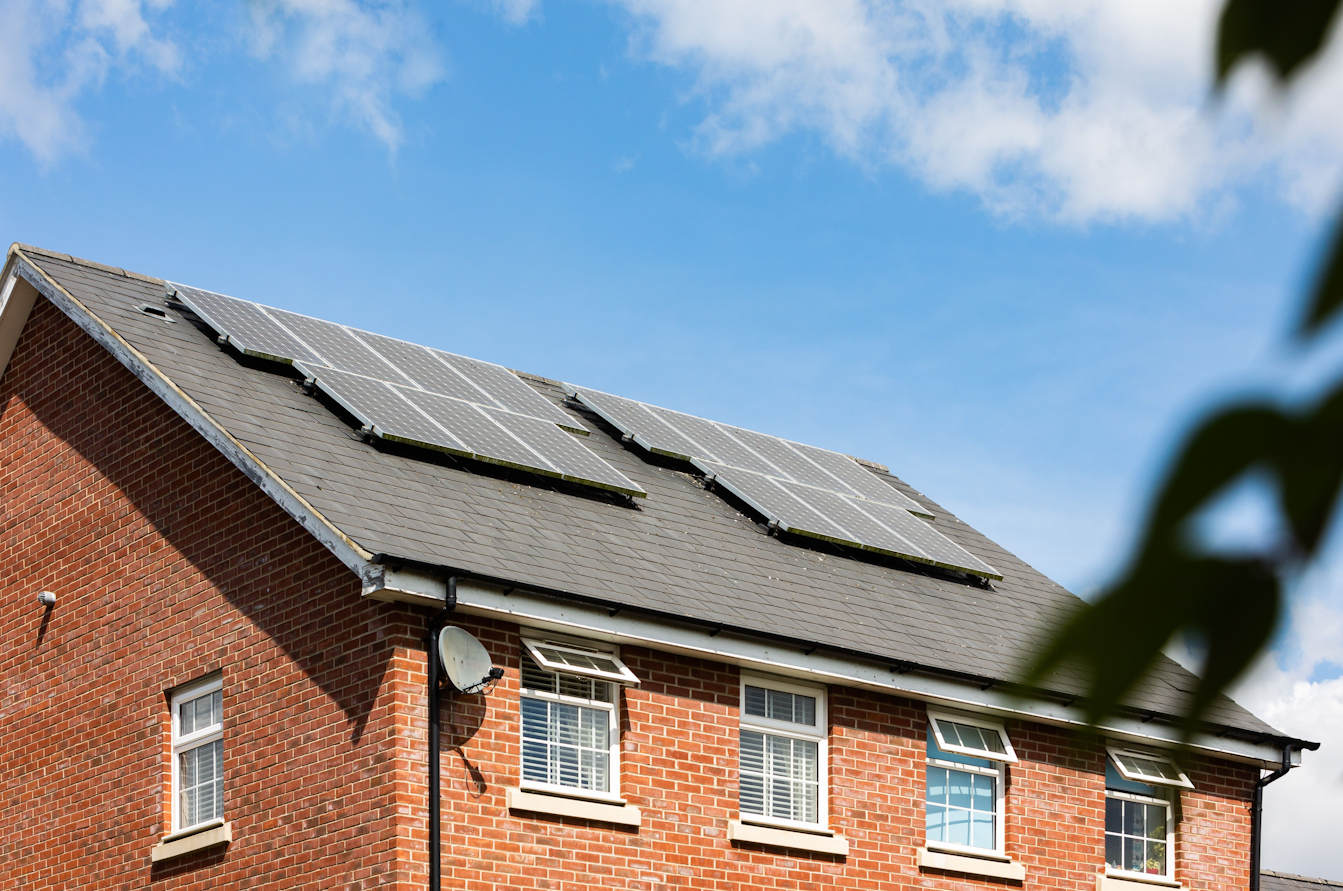 An eco-friendly loft conversion with solar panels on the roof.